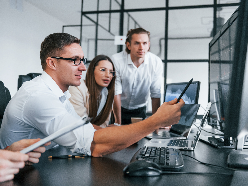 IT staff working around a computer