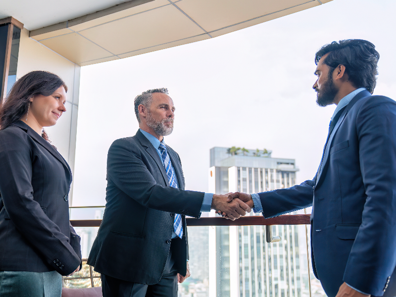 Office workers handshake