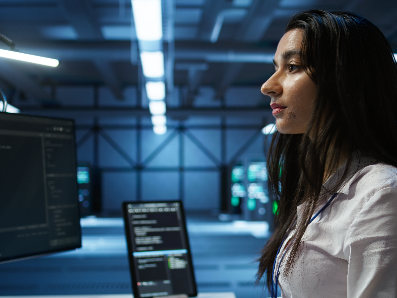 Woman IT coding at computers