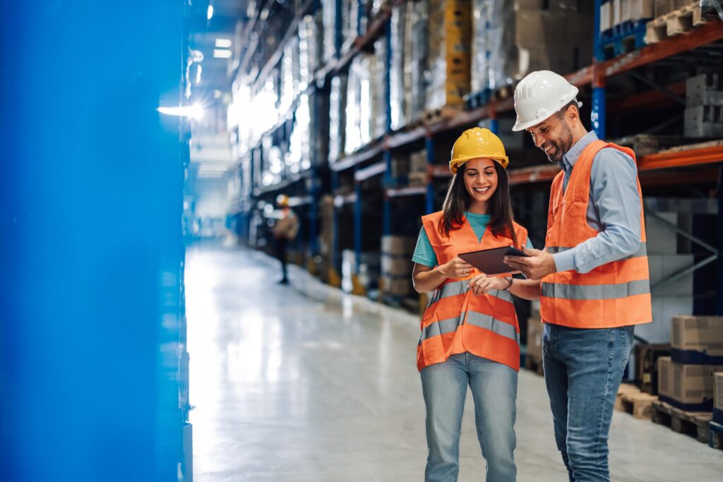 warehouse workers with tablets