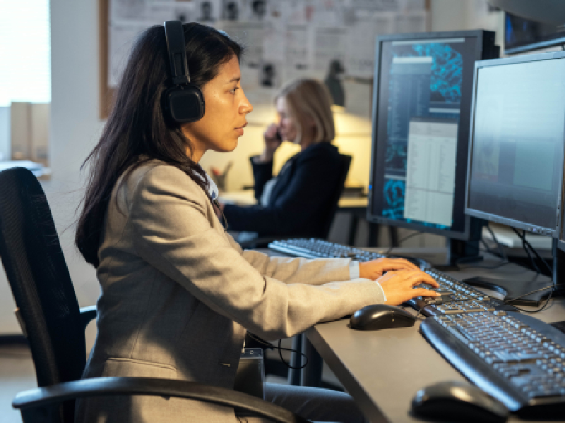 Woman sitting at the computer typing