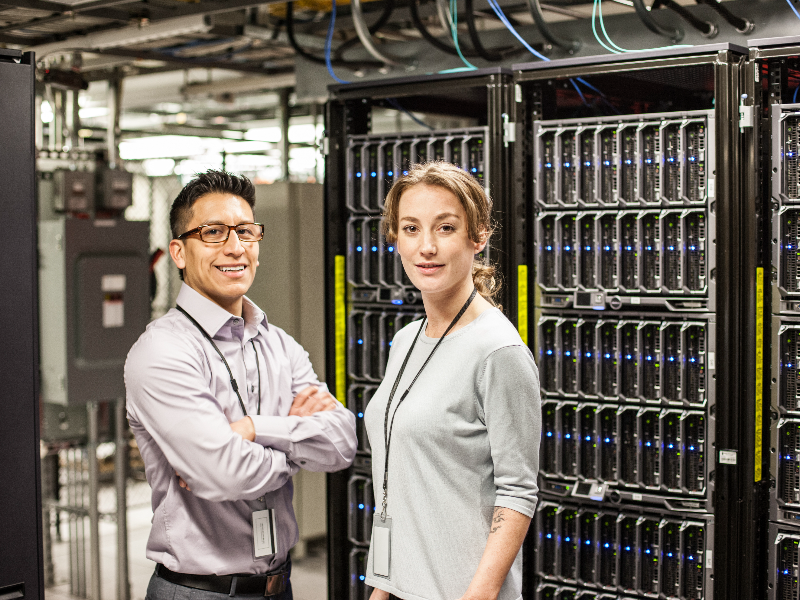 Staff in front of data servers