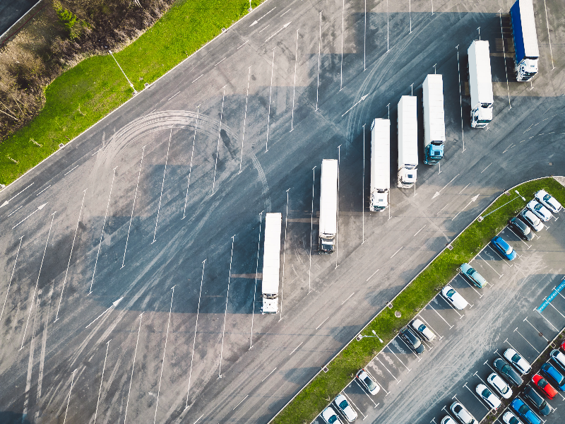 Delivery trucks parked in a car park