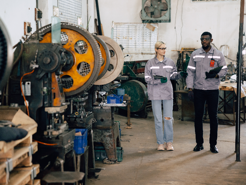 Two workers in a tool making factory