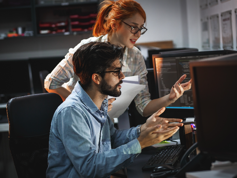 IT technicians at a computer