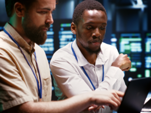 Staff at a computer using working together